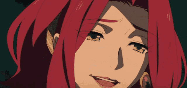 a woman with red hair and earrings is laughing