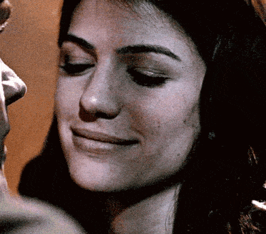 a close up of a woman 's face with a man 's nose