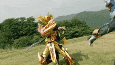 a man in a gold armor is standing in a field