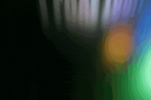 a dark background with a rainbow of colors coming out of it