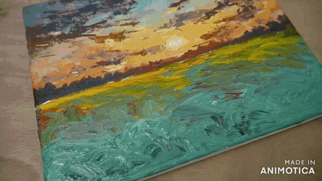 a painting of a sunset with the words made in animotica below it