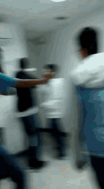 a blurry picture of people in a hospital