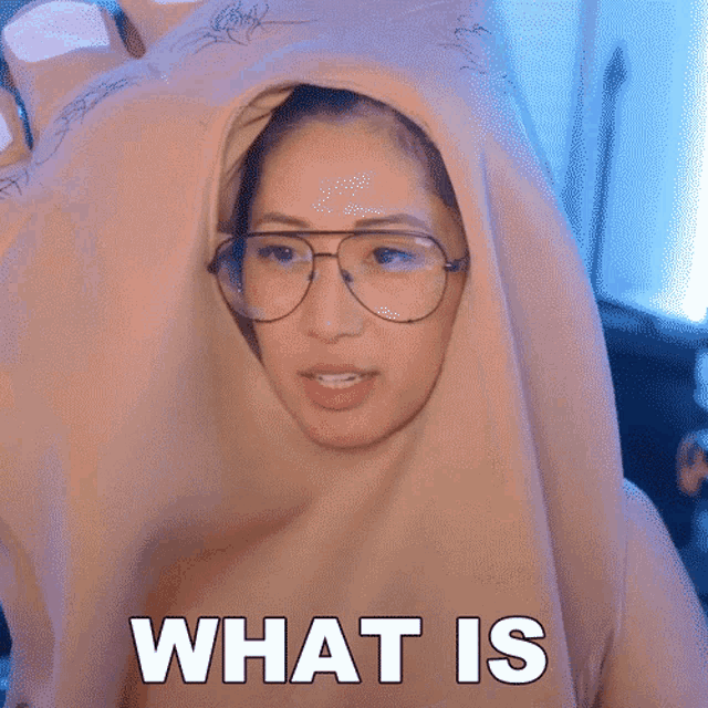 a woman wearing glasses and a hood with the words going on written on it
