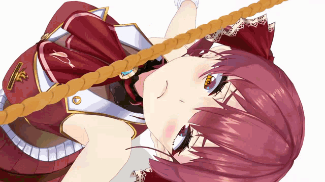 a girl with red hair is laying on her back