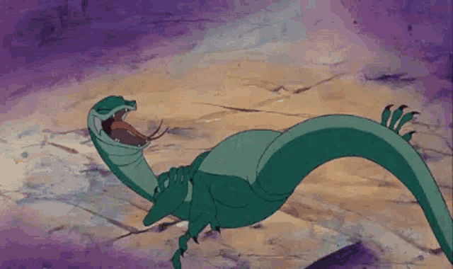 a cartoon lizard is crawling on the ground with its tongue out .