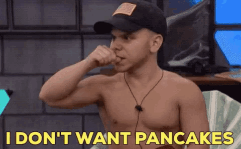 a shirtless man in a hat says i don t want pancakes