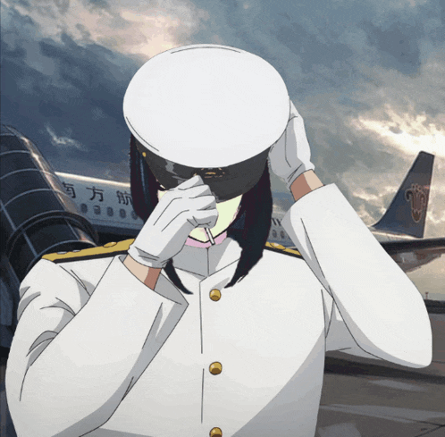 a man in a white uniform stands in front of an airplane with chinese writing on the side
