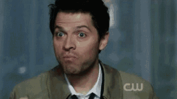 a man is eating a sandwich and making a funny face while saying `` exactly ! ''