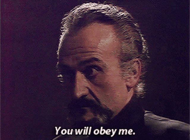 a man says " you will obey me " in a dark room