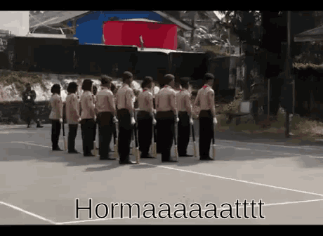 a group of people standing in a line with hormaaaattttt written in the corner