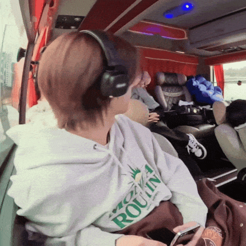 a person wearing headphones is wearing a sweatshirt that says york routin