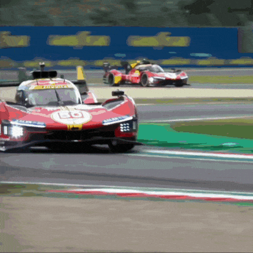 a red race car with the number 50 on the front