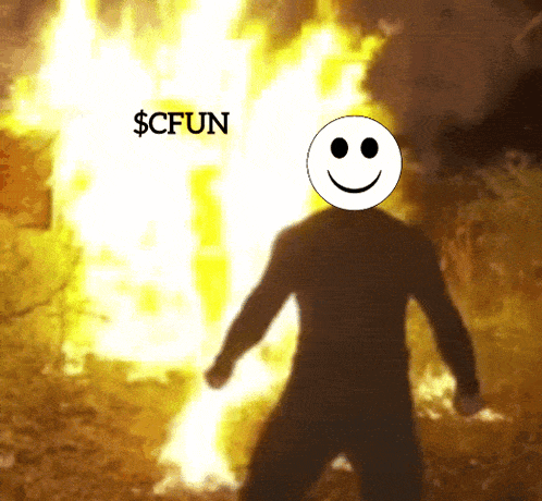 a man with a smiley face on his head is standing in front of a fire with the words $ cffun written above him
