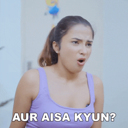 a woman in a purple tank top is making a funny face with the words aur aisa kyun below her