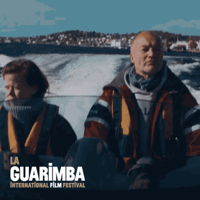 a poster for the la guarimba international film festival shows a man and a woman in a boat