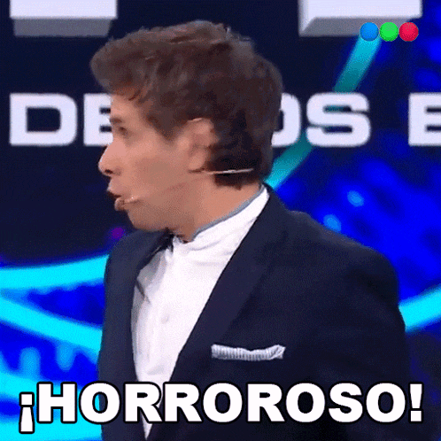 a man in a suit says " horroroso " in spanish