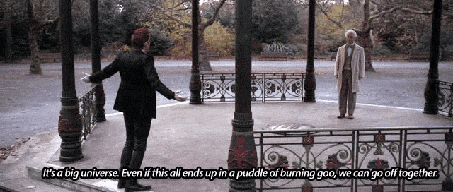 two men standing in a park with the words it 's a big universe on the bottom