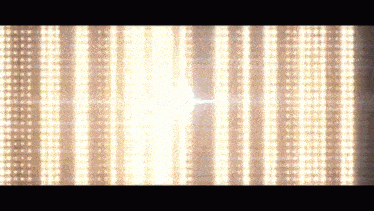 a bunch of lights are shining on a dark background
