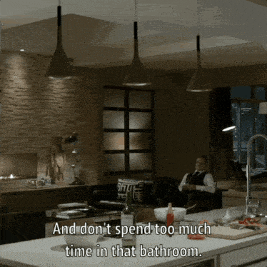 a man sits on a couch in a living room with the words " and don 't spend too much time in that bathroom "