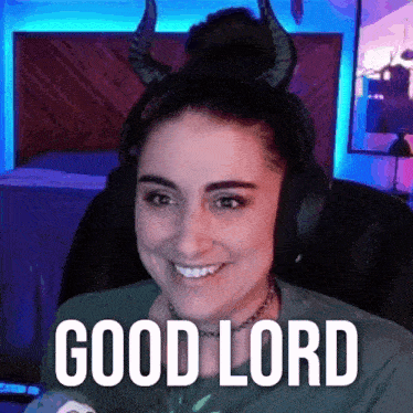 a woman wearing horns and headphones is smiling and saying good lord .