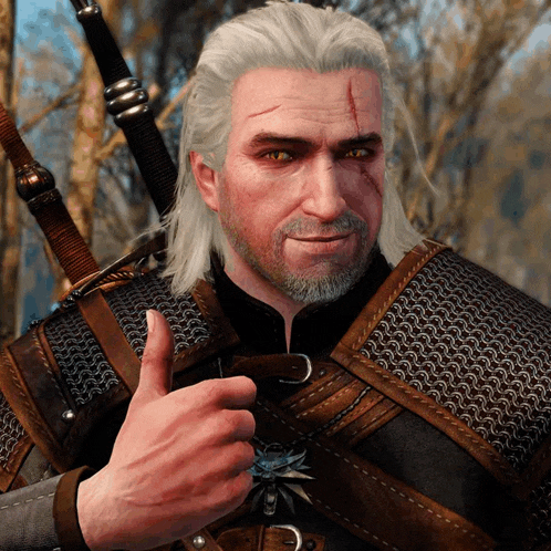 a man with gray hair and a beard is giving a thumbs up