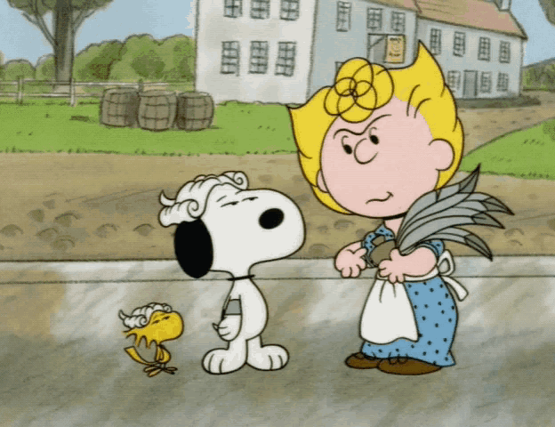 a cartoon of snoopy standing next to a woman