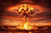 a nuclear explosion with a mushroom cloud in the sky .