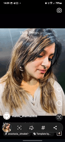 a woman 's face is displayed on a phone screen