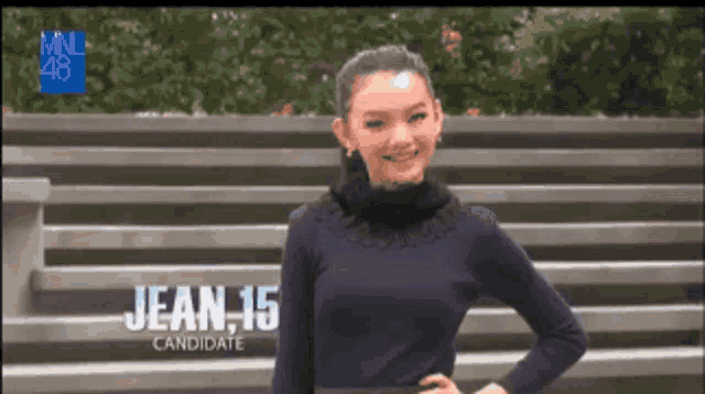 a woman is standing in front of a sign that says jean 16