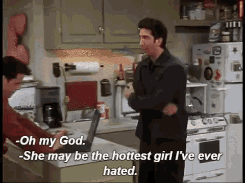two men are standing in a kitchen and one of them is saying oh my god