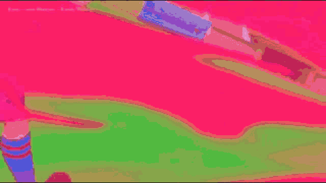 a person is standing in a pink room with a pink background .