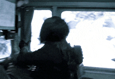 a person standing in front of a window with a sign on it that says ' a ' on it