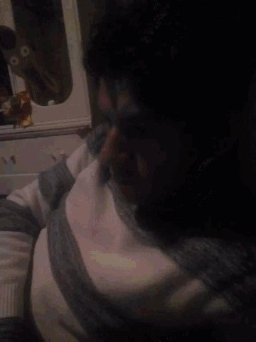 a man in a striped sweater is laying down