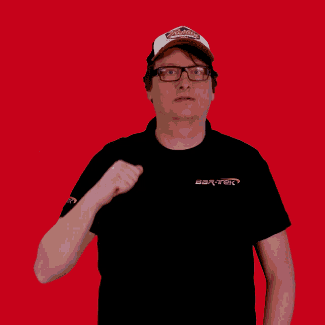 a man wearing glasses and a hat that says raptors