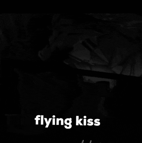 a black and white photo of two people with the words flying kiss on the bottom