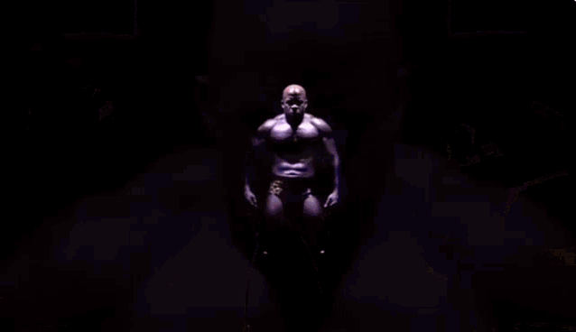 a man is standing in front of a screen that says ' s ' on it