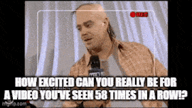 a bald man with a mohawk is talking into a microphone while being recorded ..