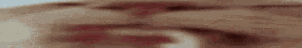a close up of a person 's face with blood on it