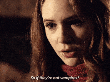 a close up of a woman 's face with the words so if they 're not vampires