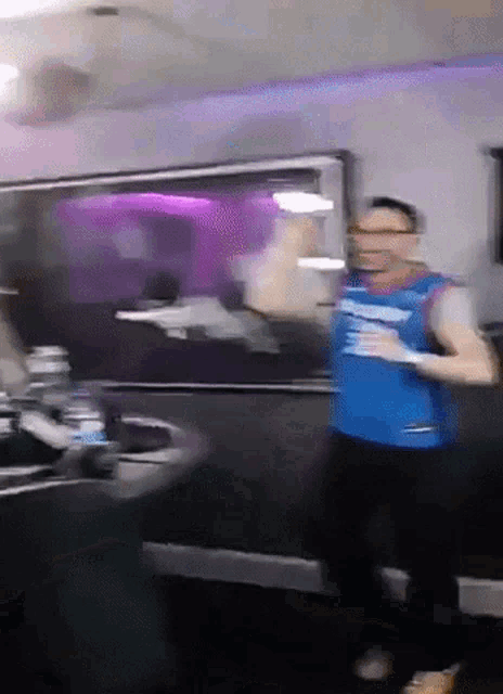 a blurry picture of a man wearing a blue shirt that says ' i love you ' on it