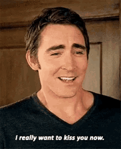 a man is smiling and says `` i really want to kiss you now '' .