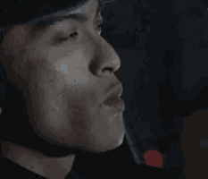 a close up of a person 's face with their mouth open