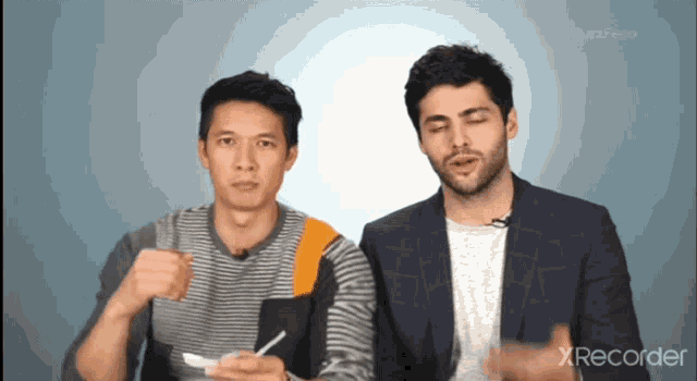 two men are sitting next to each other with xrecorder in the corner of the screen