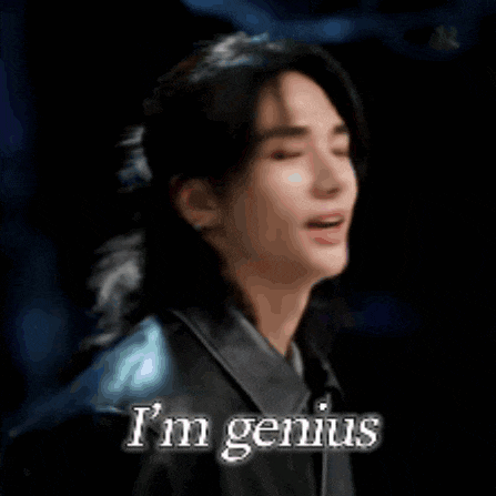a close up of a person 's face with the words `` i 'm genius '' written on it .