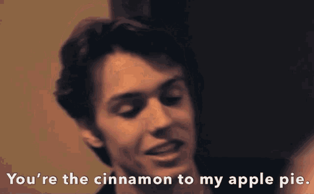 a close up of a man with the words you 're the cinnamon to my apple pie