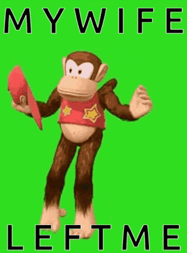 a monkey is standing on a green screen holding a hat .
