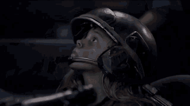 a woman wearing a helmet with a microphone on her head
