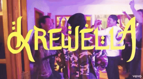 a group of people are dancing in front of a sign that says ' rewella '