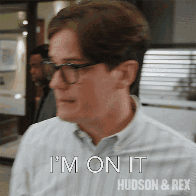 a man wearing glasses says " i 'm on it "