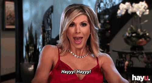 a woman in a red dress is saying hayyy hayyy